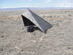 Personal Survival Tarp on Desert pitched using Walking Stick